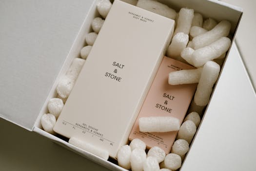 Stylish packaging of Salt & Stone products with protective packing peanuts.