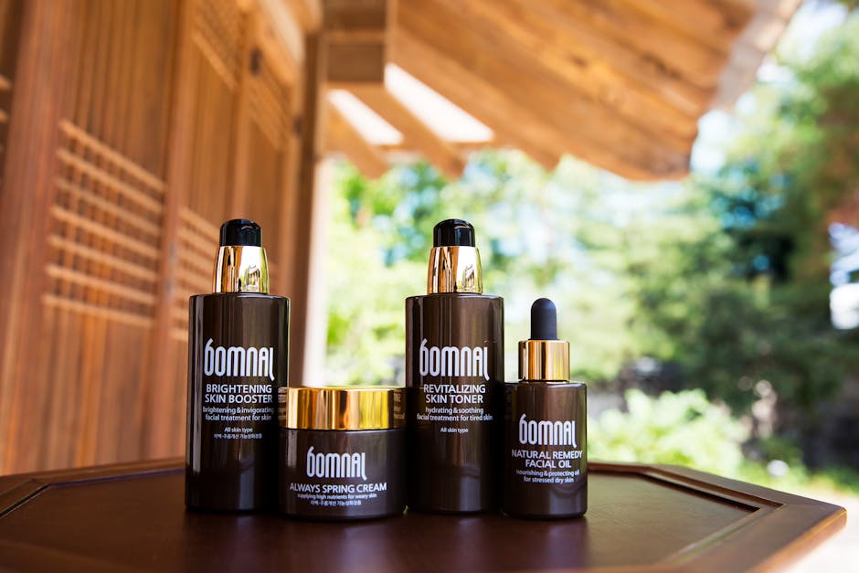 Elegant Bomnal skincare set displayed on a wooden table with natural outdoor background.